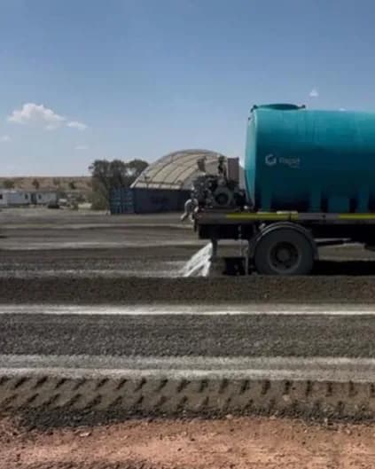 Heavy plant standing on a level, bound pad