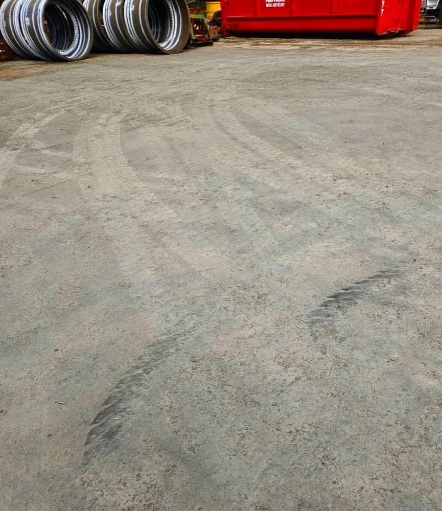 Tyre marks from a 5 tonne forklift turn, sitting on top of a treated surface